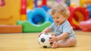 Kid playing with size 1 soccer ball